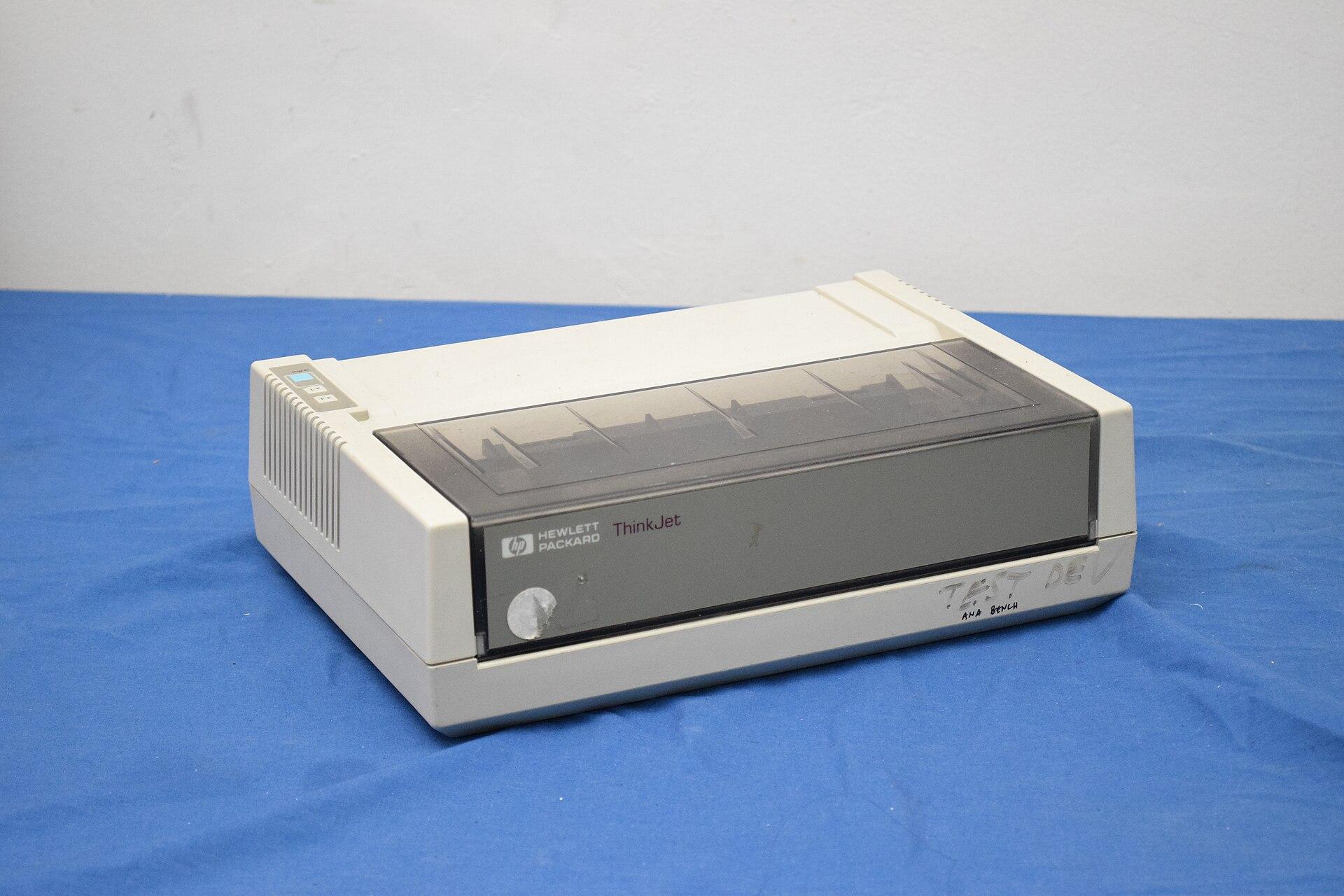 HP ThinkJet, a small beige 1980s desktop printer with a fold-down paper path and a simple control panel