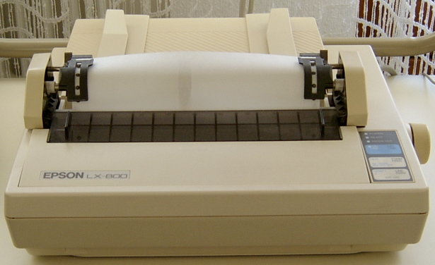 Epson LX-800 dot matrix printer, a beige 1980s impact printer with a paper guide and control panel