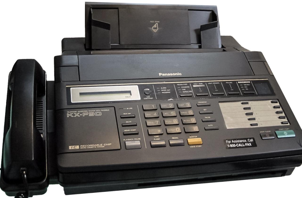 Panasonic KX-F90 office fax machine with corded handset and paper output tray